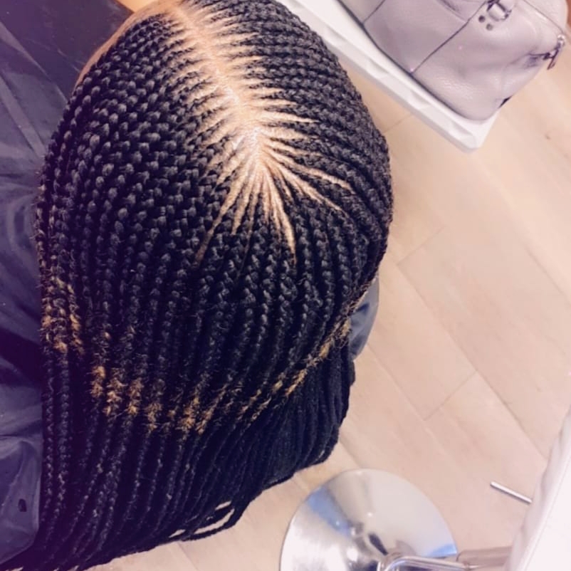 Cornrows with a clean, sharp center part