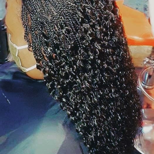 Box braids with red highlights, side view